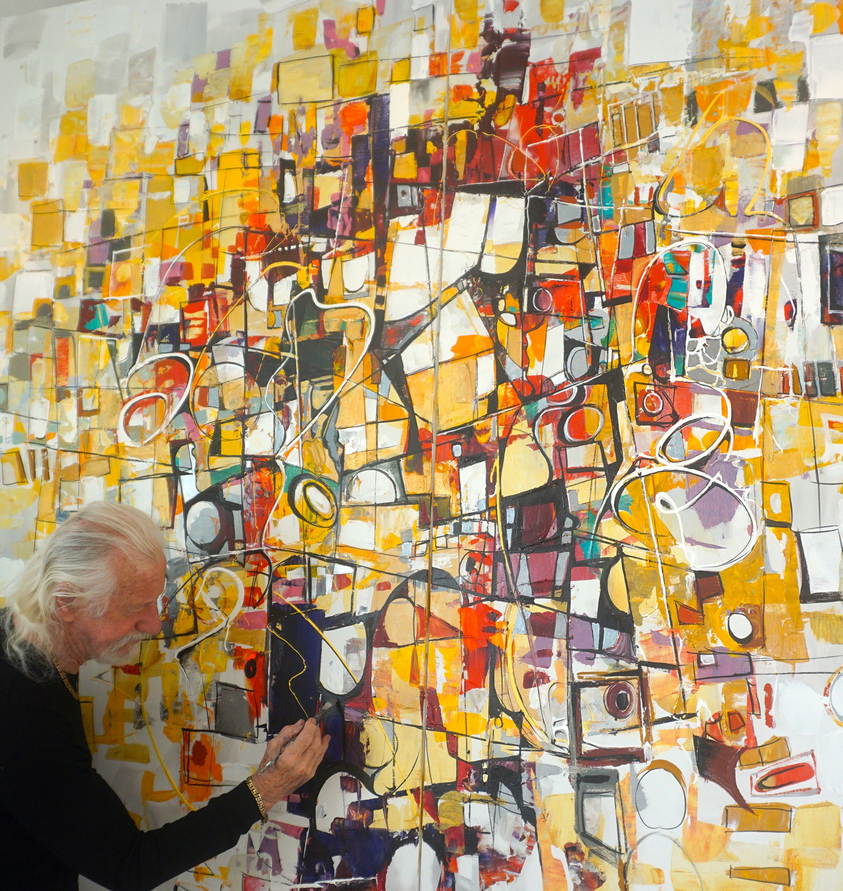 Paul Ygartua painting abstract art in his studio